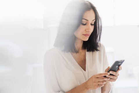 Woman using smart phone.
