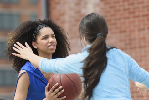 Teenage girls (14-15, 16-17) playing basketball.