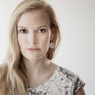 Portrait of mid-adult woman on white background.