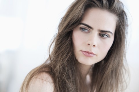 Portrait of young woman with blue eyes.