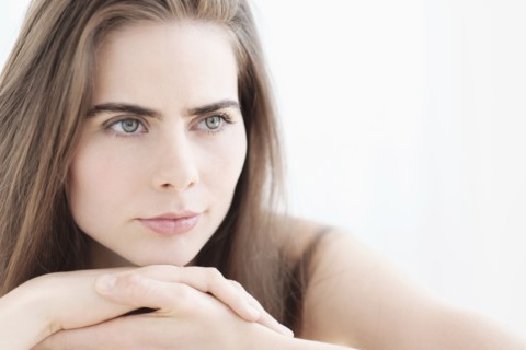 Portrait of young woman with blue eyes.