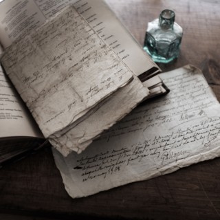 Old letters and inkwell.