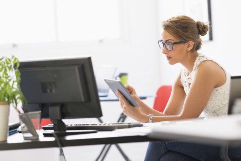 Young woman working in office.