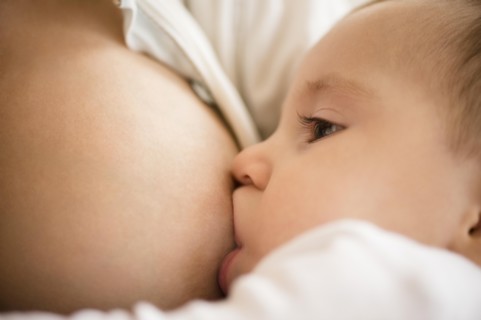 Mother breastfeeding her daughter (2-5 months)