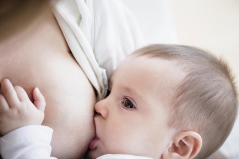 Mother breastfeeding her daughter (2-5 months)