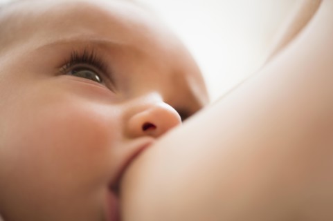 Mother breastfeeding her daughter (2-5 months)