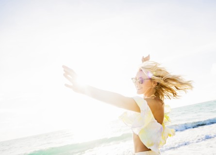 Young woman smiling on beach