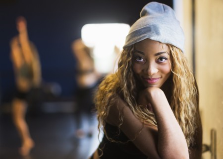 Portrait of female dancer with friends in background