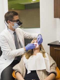 Dentist and patient in dentist's office