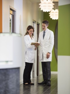 Dentists talking in corridor