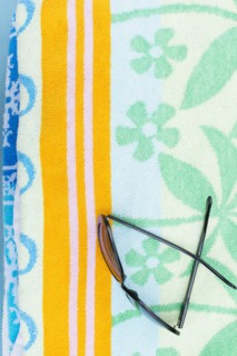 Sunglasses on towel
