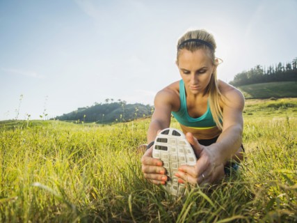 Woman exercising in field