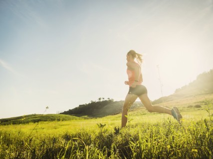 Woman running in field