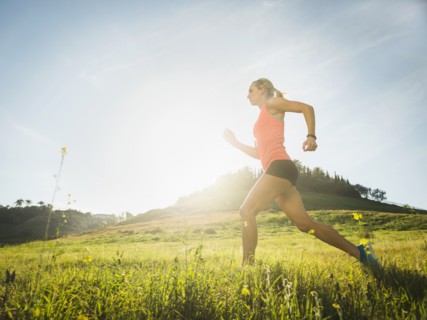 Woman running in field