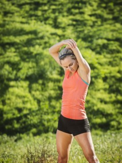 Woman exercising in field