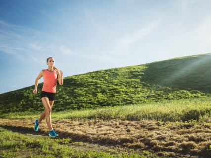 Woman running in field