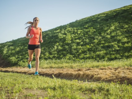 Woman running in field