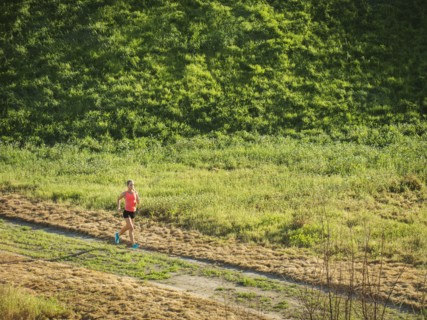 Woman running in field