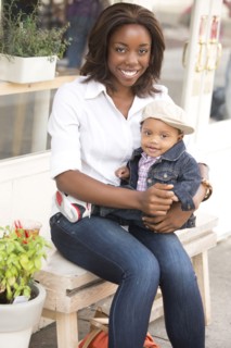 Portrait of smiling woman holding son (12-17 months)