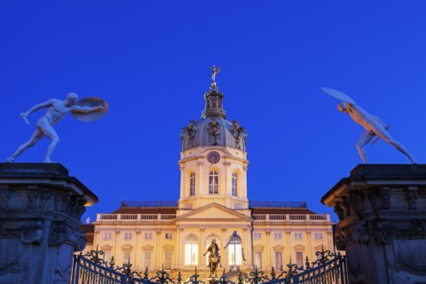 Charlottenburg Palace facade and entrance statues at night