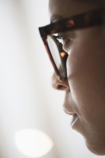 Close up of young woman in nerdy glasses.