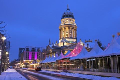 Christmas Market and illuminated steeple of French Cathedral