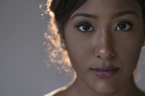 Portrait of young woman in studio.