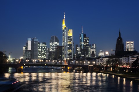 Illuminated riverfront skyline
