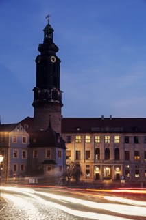 Light trails and clock tower at night