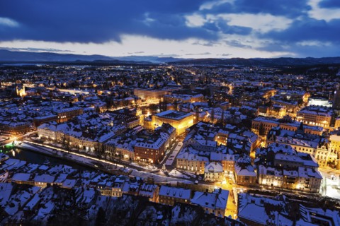 Illuminated cityscape at dusk