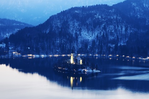 Lake Bled and illuminated Church of the Assumption on island