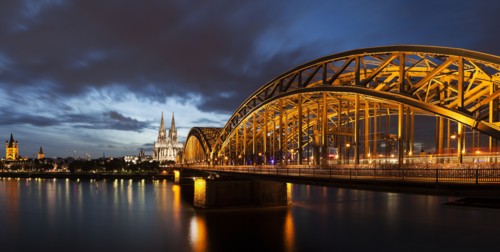 Hohenzollern Bridge illuminated at dusk