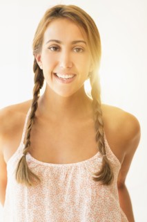 Portrait of young woman in studio.