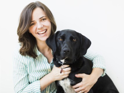 Portrait of smiling woman with dog