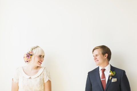 Smiling newlywed couple in studio