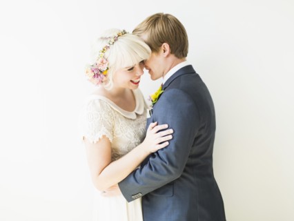 Smiling newlywed couple embracing