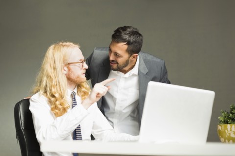 Businessmen talking in office