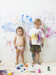 Children (2-3) painting on wall