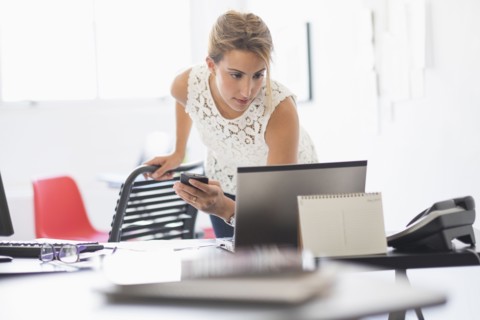 Young woman working in office.