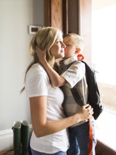 Son (6-7) kissing mother on cheek