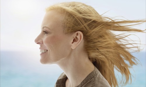 Portrait of woman by sea.