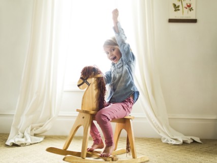 Girl (4-5)on rocking horse