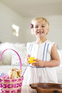 Portrait of girl (2-3) holding candy
