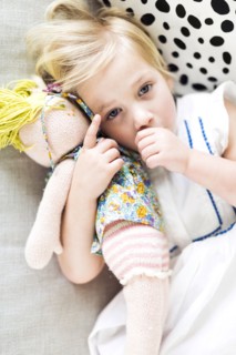 Portrait of girl (2-3) relaxing on sofa