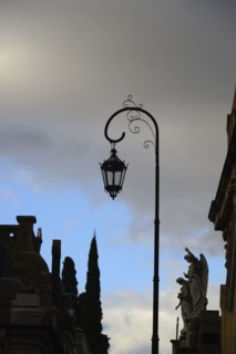 Argentina, Buenos Aires, Recoleta Cemetery, Sculpture and antique street light