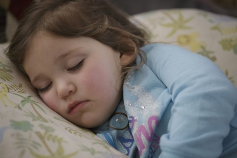 Girl sleeping in bed
