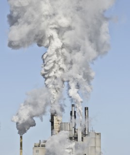 Smoke stacks emitting smoke