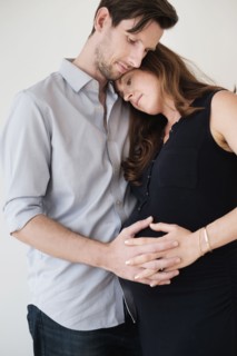 Portrait of content couple holding hands.