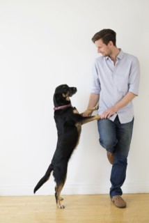 Man playing with dog.