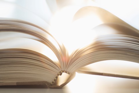 Book on table.